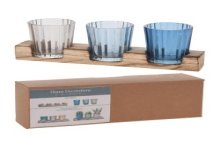 Theelichthouderset glas op houten plank